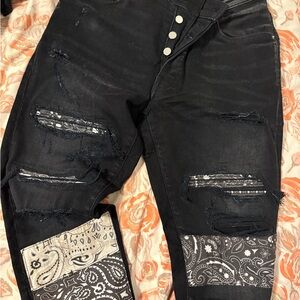 AMIRI Black Skinny Jeans with Distressed Paisley Accents